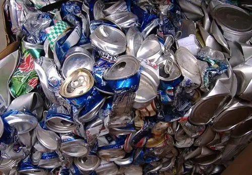 Loose crushed used aluminium beverage cans ready for recycling
